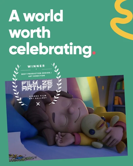 A world worth celebrating. Maia asleep beside Ducky in a tilted film still, with a white Film Art X Vienna award laurel overlapping the photo and green background.