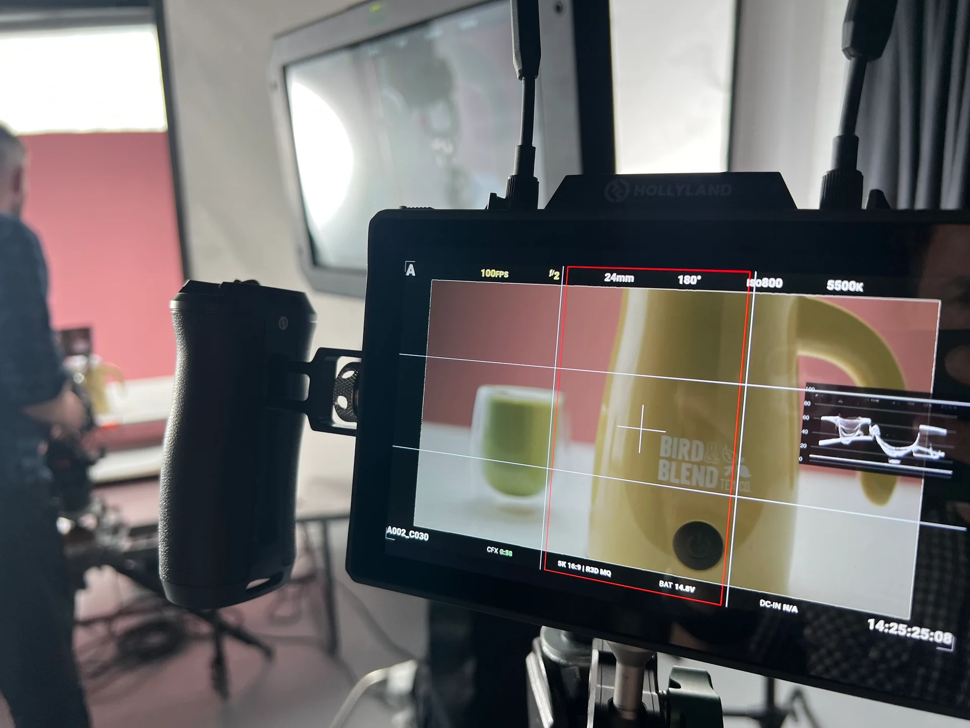 Camera monitor showing a close-up of the yellow Bird & Blend Magic Whisk during filming.