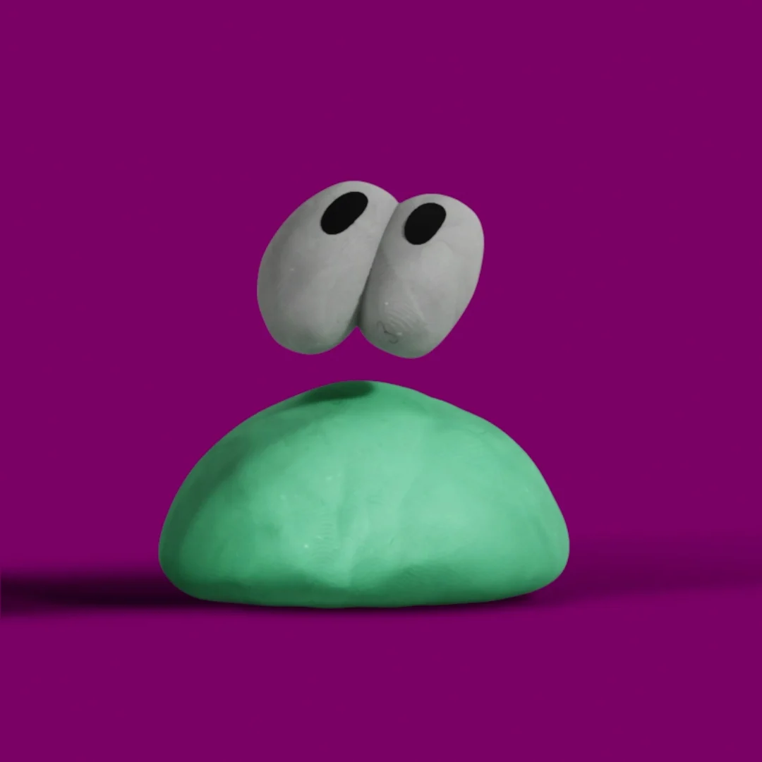 Two white eyes hovering over the soft green dollop.