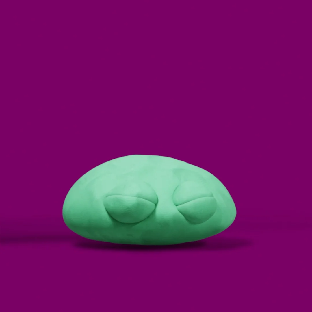 The green character squashed low with its eyes closed.